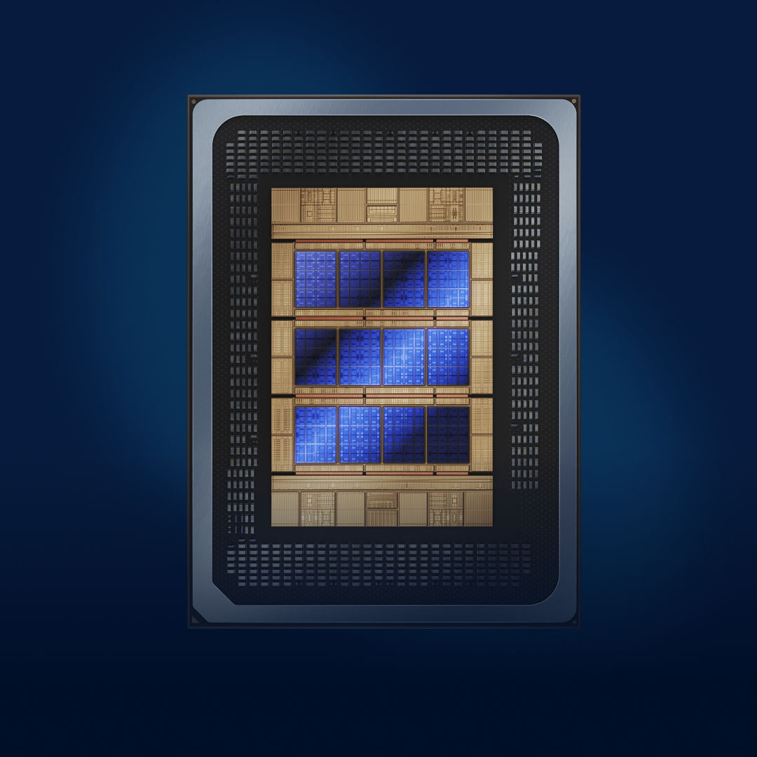 Close up of a silicon processor chip seated inside a rectangular slot, with gold contacts visible against a dark background.